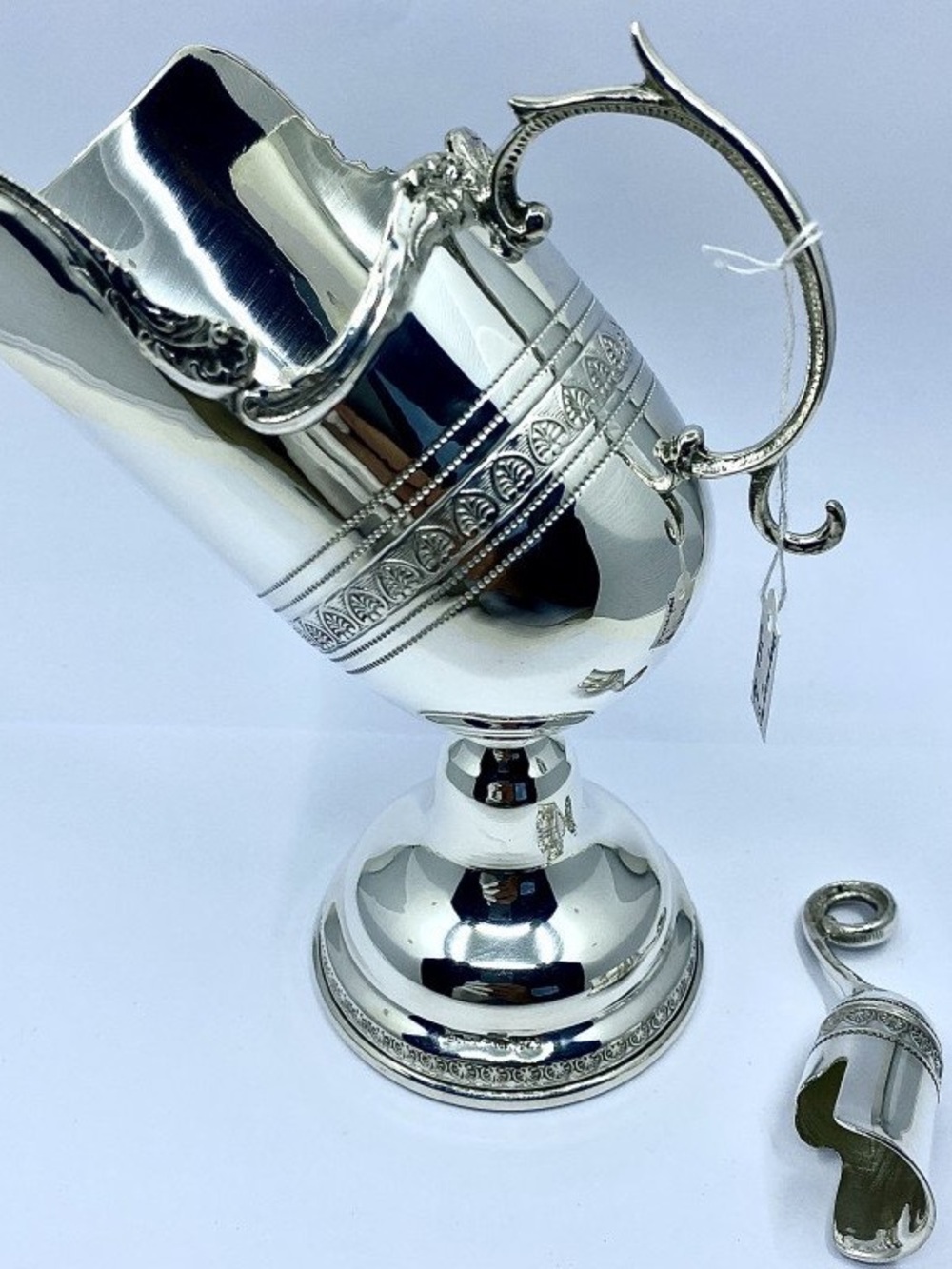 Elegant Silver-Plated Pitcher with Decorative Handle